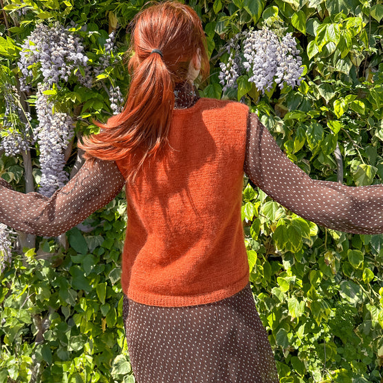 

Tanjun - Pull sans manches
5